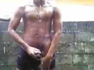 Athletic Ebony Dude Busts A Nut In The Rain